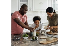 Family cooking in kitchen.